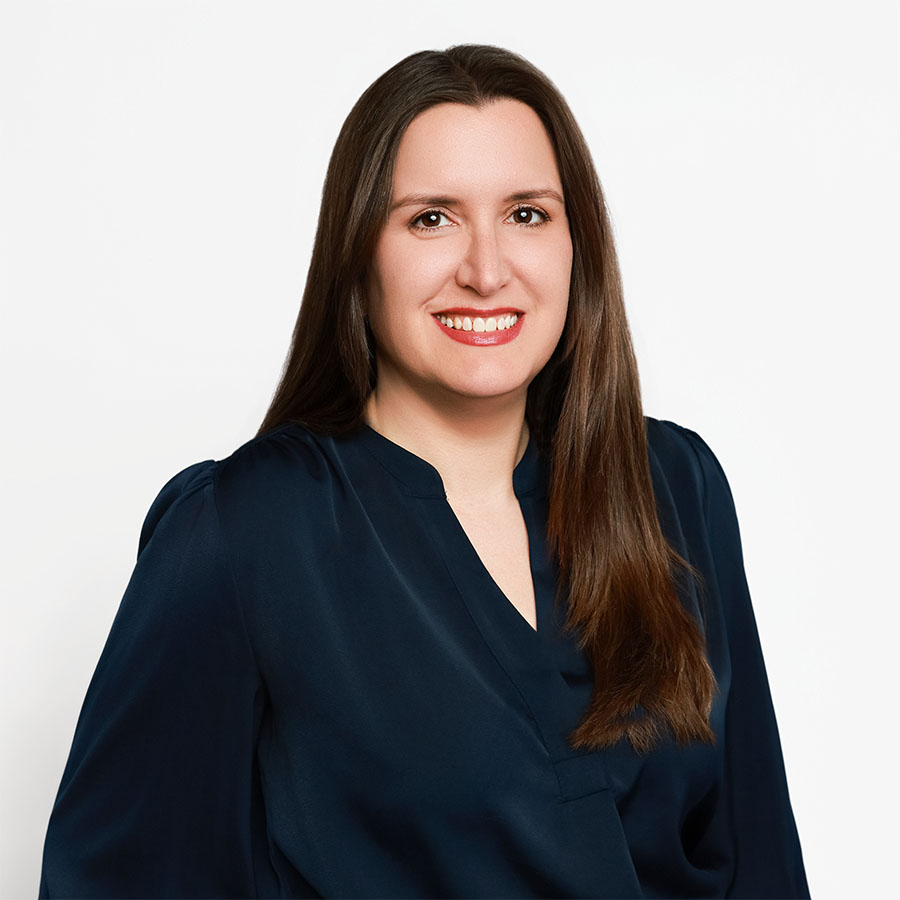 Professional headshot of Izzy Straub