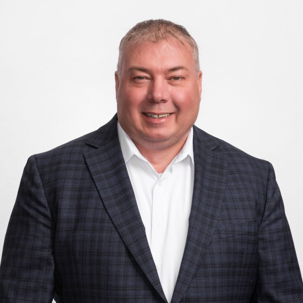 Professional headshot of Jay Woodcock